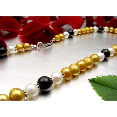 Kette aus Perlen und Onyx gelb-schwarz-weiß