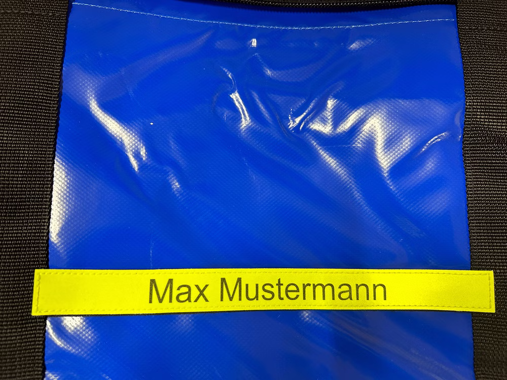 Klettschild mit Beschriftung für Fenomed Bekleidungstasche