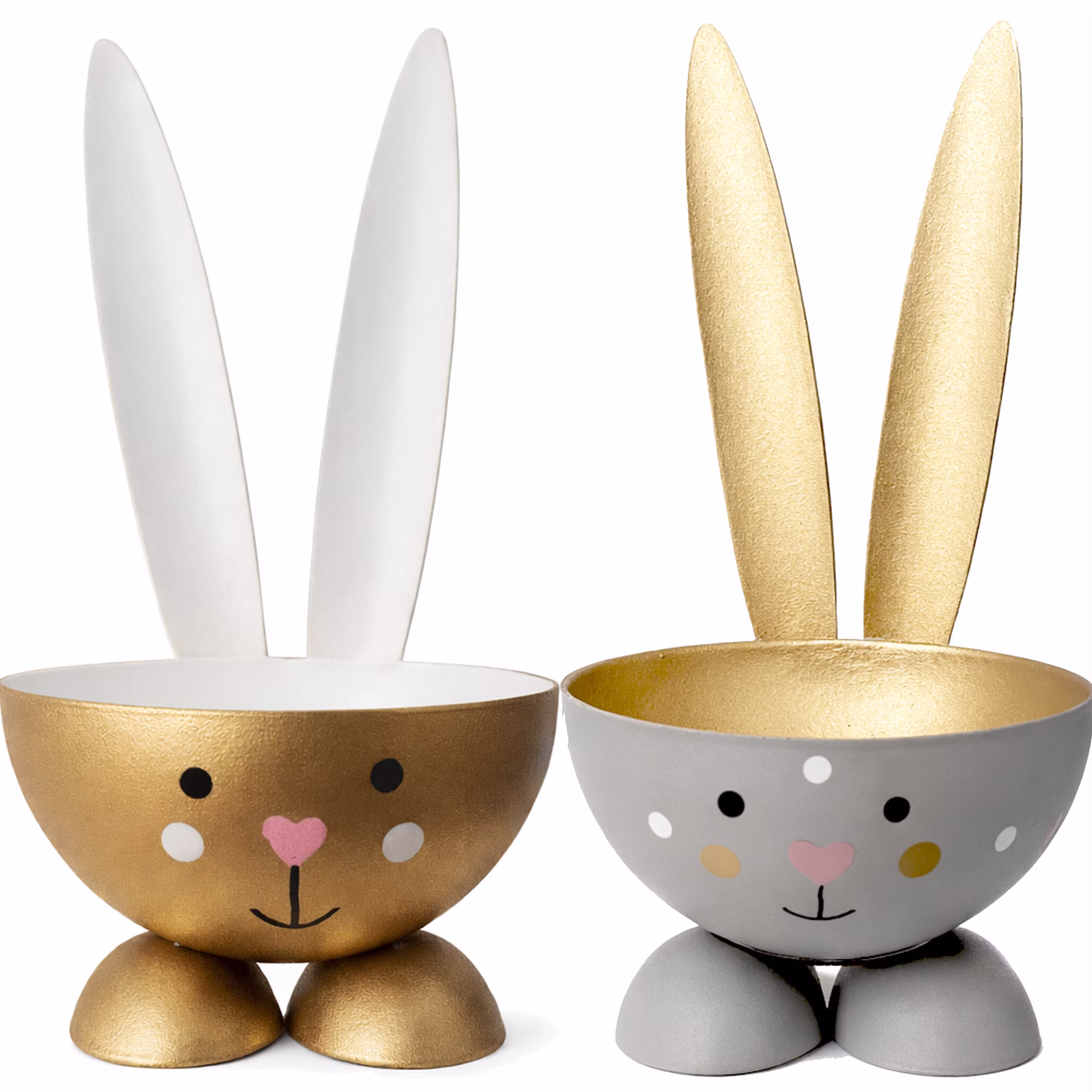 Zwei Osterhasen-Eierbecher in Gold und Grau mit langen Ohren und Herz-Nase auf weißem Hintergrund.