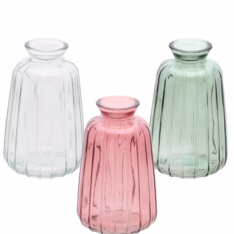 Glasvase Verone 11 cm Vintage Tischvase Rosa Grün Transparent Deko Geburtstag Tisch-Deko Hochzeit Geburtstag Vase aus Glas festliche Tischdeko Wohnaccessoire Glasvase dekorativ Glasvase Verone in drei Farbvarianten: Transparent, Rosa und Grün, gemeinsam freigestellt auf hellem Hintergrund.