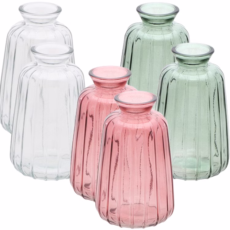 Glasvasen Verone 6er Tischvase Rosa Grün & Transparent Tisch-Deko Hochzeit Geburtstag Vase aus Glas festliche Tischdeko Wohnaccessoire Glasvase dekorativ 6er-Set Glasvasen Verone in Rosa, Grün und Transparent, dekorativ als farblich sortiertes Tischvasen-Set arrangiert.