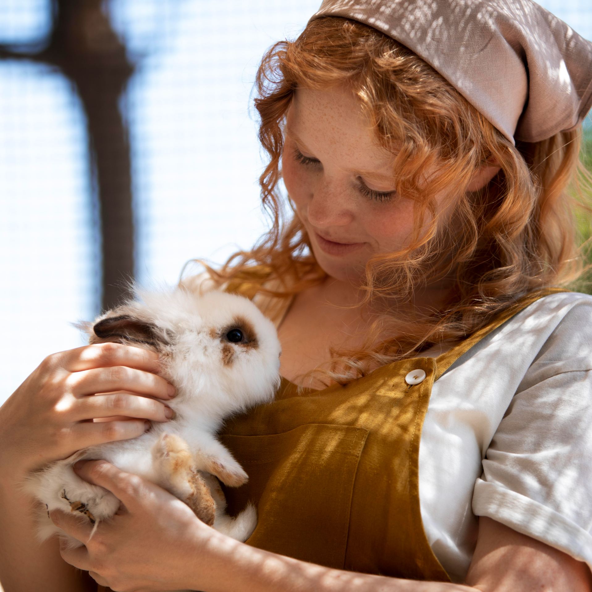 medium-shot-woman-holding-rabbit.jpg