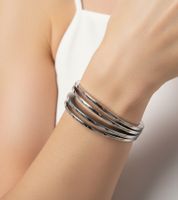Modern Calvin Klein Women's Stainless Steel Bracelet in a Curved Design, Wrist Jewelry KJ3DMD0801 Silver