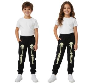Pantalon de jogging stylé pour enfants (filles et garçons), imprimé squelette fluorescent, noir, réf. 926587