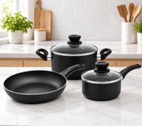 Juego de utensilios de cocina Krüger de 3 piezas: sartén (24 x 5 cm), cacerola con tapa (16 x 7 cm) y olla con tapa (20 x 8 cm) - revestimiento antiadherente. **Producto de segunda mano – probado y en perfecto funcionamiento**. Color negro.