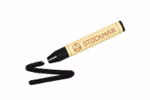 Ein STOCKMAR Wachsmalstifte Einzelstift in Schwarz von Stockmar ruht auf einer weißen Fläche von deren Spitze eine schwarze Wellenlinie ausgeht. schwarz