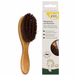 Babybürste aus Rosshaar GRÜNSPECHT Babybürste aus Buchenholz mit dunklen Naturborsten aus Rosshaar für die Haarpflege von Babys und Kindern neben der Verpackung.