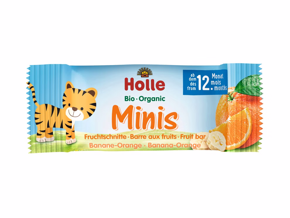 Holle Bio-Minis Banane-Orange ab dem 12. Monat_21216 Ein Holle Bio-Minis Banane-Orange ab dem 12. Monat zeigt auf der Verpackung einen lächelnden Tiger und Fruchtscheiben. Auf der Verpackung steht dass der Riegel ab dem 12. Monat geeignet ist und sie enthält einen deutschen französischen und englischen Text.