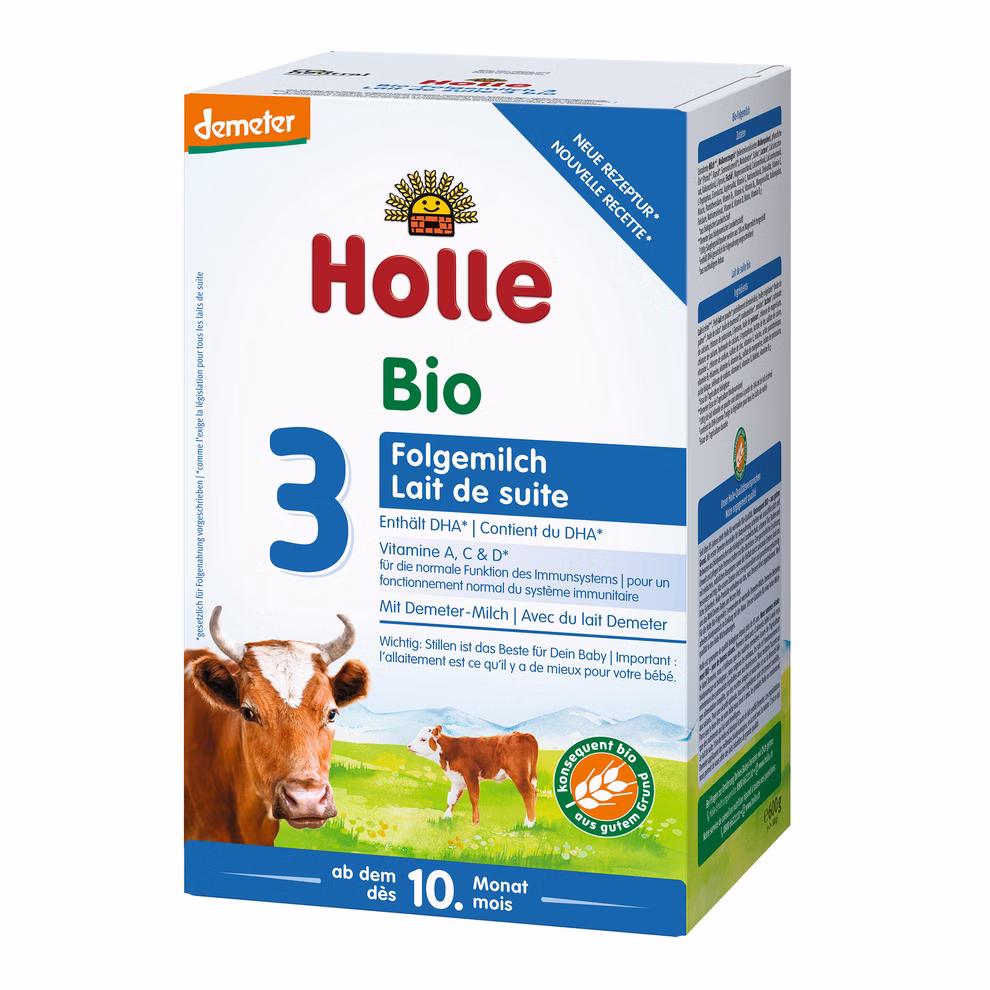 Holle Bio-Folgemilch 3 ab dem 10. Monat_21167 Schachtel mit Holle Bio-Folgemilch 3 ab dem 10. Monat Bio-Folgemilch für Babys ab dem 10. Monat mit einer Kuh-Illustration und Produktinformationen in Deutsch und Französisch.