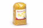 Karl Schubert Gemeinschaft Bienenwachs Pastillen 1 kg _20727 Ein durchsichtiger Plastikbeutel der 1 kg kleine gelbe Bienenwachs-Pastillen der Karl Schubert Gemeinschaft enthält mit einem gelben deutschen Etikett mit Produktangaben.