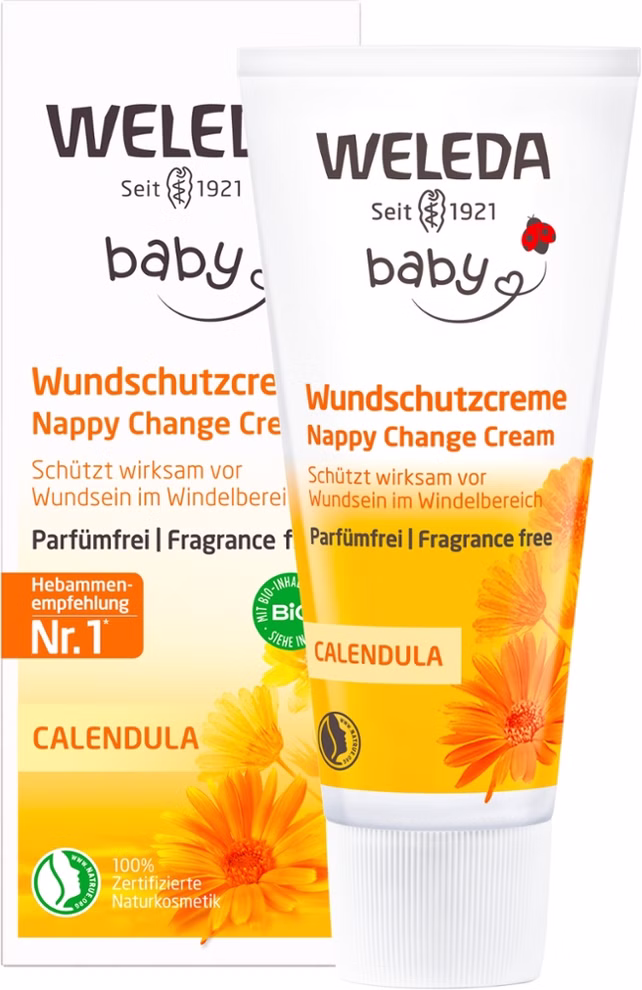 Weleda Calendula Wundschutzcreme parfümfrei 75 ml _31067 Eine Schachtel und eine Tube der Weleda Calendula Wundschutzcreme parfümfrei 75 ml zeigen gelbe und orangefarbene Blüten. Die Verpackung hebt Naturkosmetik parfümfrei und für empfindliche Haut geeignet auf Deutsch und Englisch hervor.