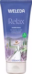 Weleda Aroma Shower Relax 200 ml_33500 Aroma Shower Relax 200 ml von Weleda ist eine violette Naturkosmetik-Duschcreme mit beruhigendem Lavendel und zeigt eine Frau in weißem Kleid und Hut die durch ein Lavendelfeld geht.