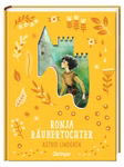 Die Ronja Räubertochter Schmuckausgabe aus dem Oetinger Verlag hat einen gelben Einband mit einem illustrierten gelockten Mädchen in einem schlossförmigen Ausschnitt umgeben von Blättern und floralen Motiven.