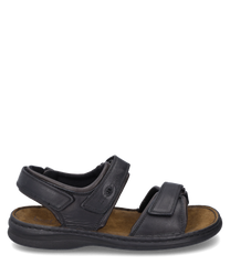 The black sandal features a practical Velcro closure and is made of high-quality material. It is equipped with a comfortable brown footbed ideal for daily comfort.