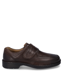 The half shoe made of dark brown leather features a practical Velcro closure. The fine stitching and robust sole give the shoe an elegant yet comfortable appearance.