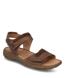 The sandal in the color castagne/combi is made of high-quality leather and features a practical Velcro closure. The design offers a comfortable fit and a sturdy sole for optimal wearing comfort.