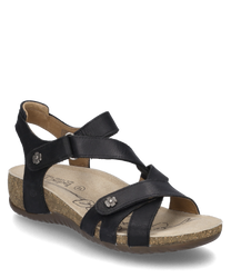 Sandale noire avec fermeture Velcro fabriquée en cuir. Elle possède une semelle en liège ergonomique et des applications florales décoratives sur les sangles.