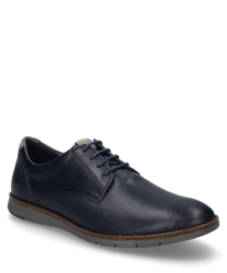 The half shoe in ocean-combi color is made of smooth dark blue leather with a fine perforated texture on the outside. It features lacing and a flat gray sole that gives the shoe an elegant look.