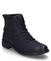 L'ankle boot nel colore Ocean colpisce per il suo design elegante e la pratica chiusura lampo. Il materiale di alta qualità garantisce durata e comfort.