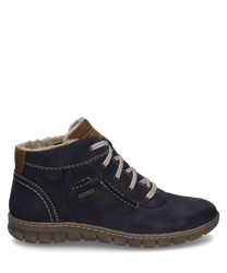 Die Stiefelette in der Farbe Ocean-Kombi besteht aus einem robusten dunkelblauen Material mit heller Schnürung und braunen Akzenten. Der Schuh ist mit einer weichen Innenfütterung ausgestattet die für zusätzlichen Komfort sorgt.
