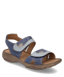 The sandal features an upper made of blue leather with light blue accents and a Velcro closure. The sole is made of light brown rubber providing comfort and stability.