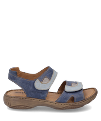 The sandal features an upper made of blue leather with light blue accents and a Velcro closure. The sole is made of light brown rubber providing comfort and stability.