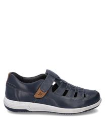 The half shoe made of dark blue leather with Velcro offers a modern design. It features brown accents and a white sole that combines comfort and style.