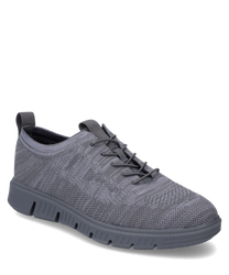 Baskets grises avec lacets en matériau tricoté respirant. La chaussure a une semelle flexible et profilée pour un confort de port optimal.