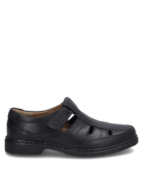 The half shoe in black color is made of smooth leather and features a practical Velcro closure. The side cutouts provide additional ventilation and comfort.