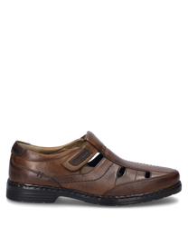 The half shoe in cognac color is made of high-quality leather and features a practical Velcro closure. Special features include decorative stitching and side cutouts for additional ventilation.