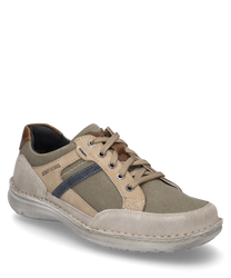 Beige lace-up shoe made of textile and leather. The shoe features brown and blue accents as well as a white sole.