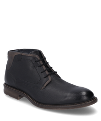 Die Stiefelette in schwarz-kombi besteht aus glattem Leder und hat eine stilvolle Schnürung. Der Schuh zeichnet sich durch einen abgerundeten Zehenbereich und einen kontrastierenden Fersenbereich aus.