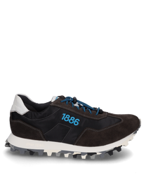 The sneaker is made from a combination of black fabric and brown suede featuring blue laces. Notably the blue number "1886" is displayed on the side and the white sole provides a serrated profile for better grip.
