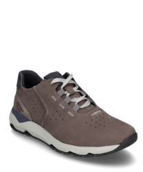 Brown sneaker with lacing made from smooth leather. The shoe features subtle perforations and a contrasting white sole that provides a modern look.