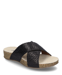 The sandal is made of black woven material and has no closure. It features a beige sole with light brown speckles that provide a natural look.