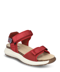 Red sandal with Velcro closure made from durable material. The sole is white and ergonomically shaped featuring a comfortable footbed and a patterned heel strap for added support.