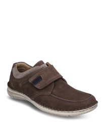 The brown suede shoe with Velcro offers comfort and style. It features contrasting stitching perforated details and a light sole for a modern look.