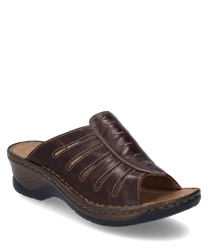 Le sabot est fabriqué en cuir marron avec une fermeture élastique. Il se distingue par une semelle intérieure confortable et une semelle stable en bois qui offre un look naturel.