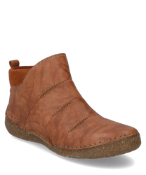 La botte en cuir marron se distingue par son look naturel et sa semelle robuste cousue. La fermeture éclair latérale permet de l'enfiler et de l'enlever facilement tandis que les coutures soignées garantissent une durabilité.