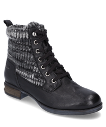 Die Stiefelette mit Schnürung kombiniert schwarzes Leder und einen gestrickten grauen Schaft der für Wärme sorgt. Der braune flache Absatz und das schlichte Design machen sie perfekt für den Alltag.