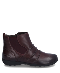 Die Stiefelette aus weichem dunkelbraunem Leder verfügt über einen seitlichen Reißverschluss für einfaches Anziehen. Sie hat dezente Ziernähte und eine bequeme flache Sohle ideal für den Alltag.