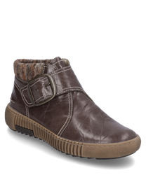 Die Stiefelette in Dunkelbraun mit Klettverschluss besteht aus Lederimitat. Sie hat ein innenliegendes warmes Futter und eine markante Schnalle an der Seite für einen stilvollen Akzent.
