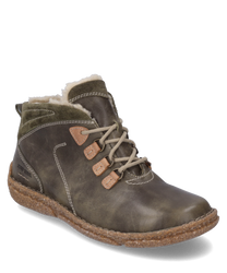 Die Stiefelette aus braunem Leder mit grünlichen Akzenten und Schnürung besticht durch ihr warmes weiches Innenfutter. Die robuste Sohle und die sorgfältigen Nähte verleihen dem Schuh einen rustikalen Charme ideal für kalte Tage.