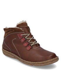 La bota está hecha de cuero marrón con forro de piel beige. Cuenta con un sistema de cordones con detalles rojos y una suela robusta de color natural.