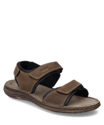 Sandale en cuir marron avec fermeture velcro. La semelle est épaisse et rembourrée offrant un grand confort de port.