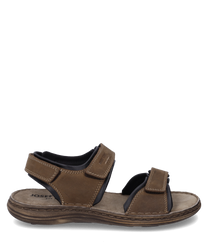 Sandale en cuir marron avec fermeture velcro. La semelle est épaisse et rembourrée offrant un grand confort de port.