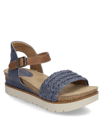 The sandal features a woven blue upper and a practical Velcro closure. The sole is made of light cork providing a natural look.