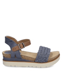 The sandal features a woven blue upper and a practical Velcro closure. The sole is made of light cork providing a natural look.
