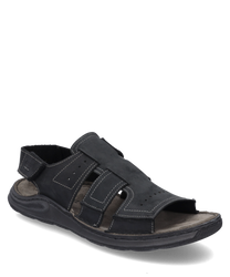 Schwarze Sandale aus Leder mit Klettverschluss. Die Sandale hat sichtbare Nähte und offene Zehen- und Fersenpartien ideal für warme Tage.