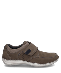 The brown leather shoe features a practical Velcro closure. Special features include contrasting stitching and perforated details on the side.